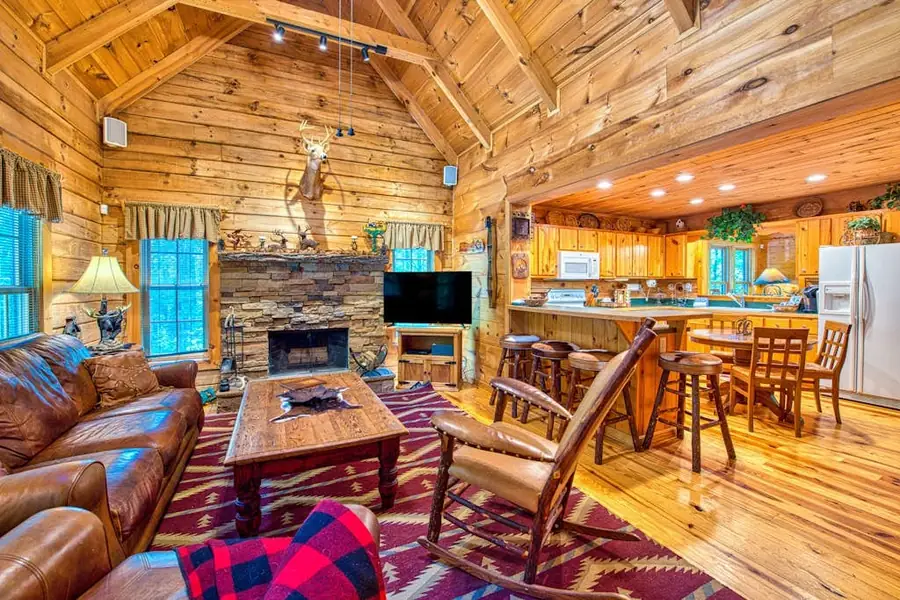Warm great room at Fallen Leaf with comfortable seating and fireplace